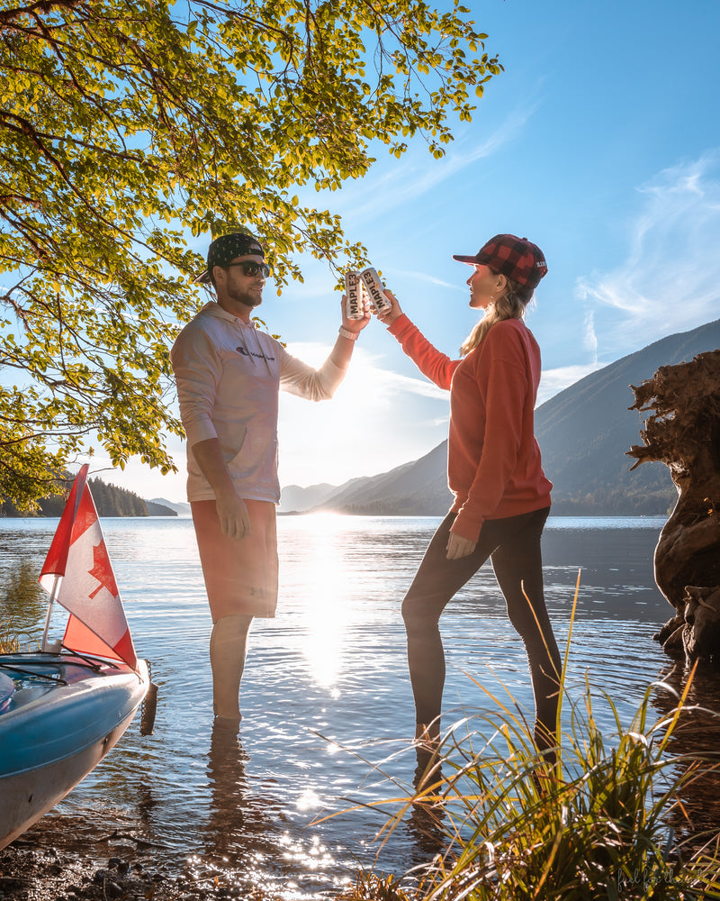 Couple enjoying their sparkling Maple 3 water by a lake in British Columbia