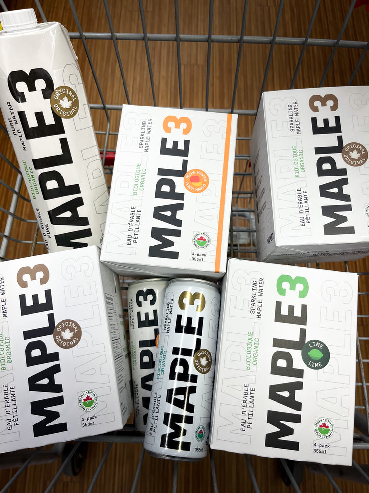 Grocery cart filled with Maple 3 organic water.